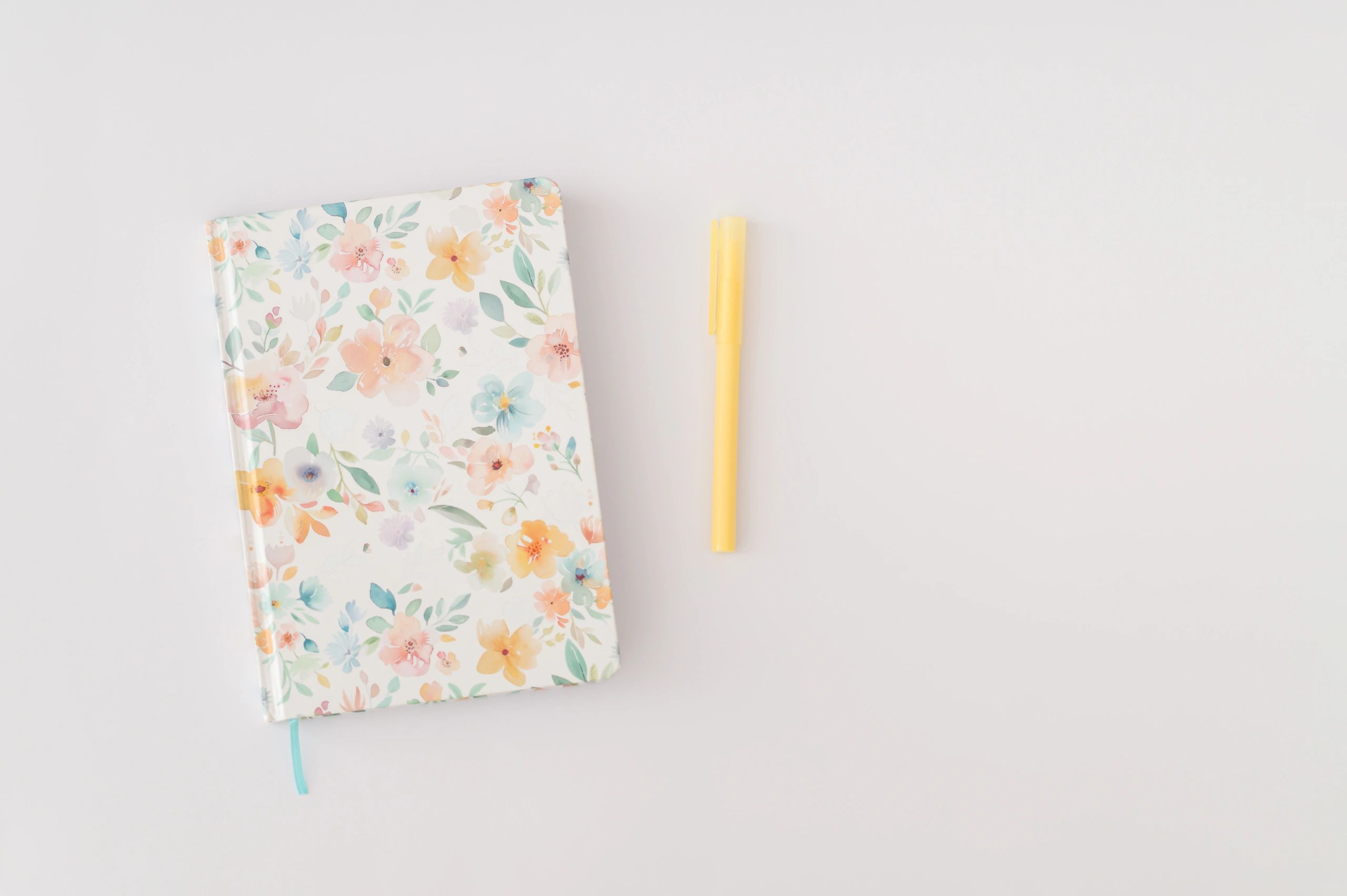 Notebook and pen arranged in a creative flat lay